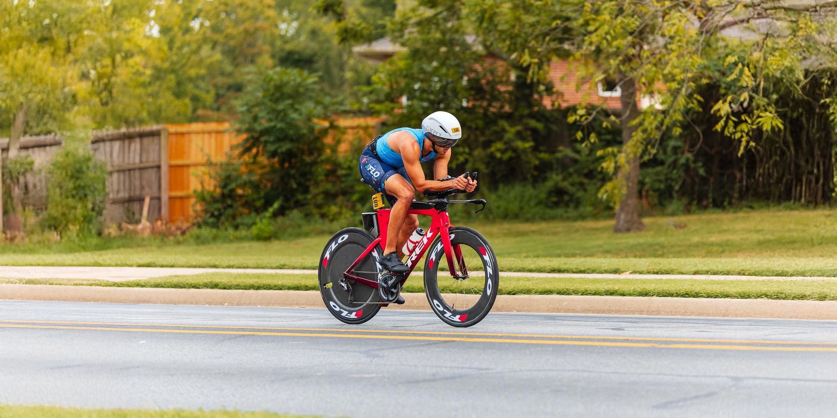 Wake Interaction: Can a Front Wheel’s Aerodynamic Profile Improve Rear Wheel Performance?